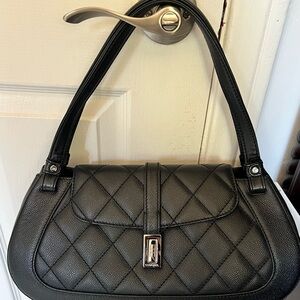 Chanel bag black caviar leather with flap.